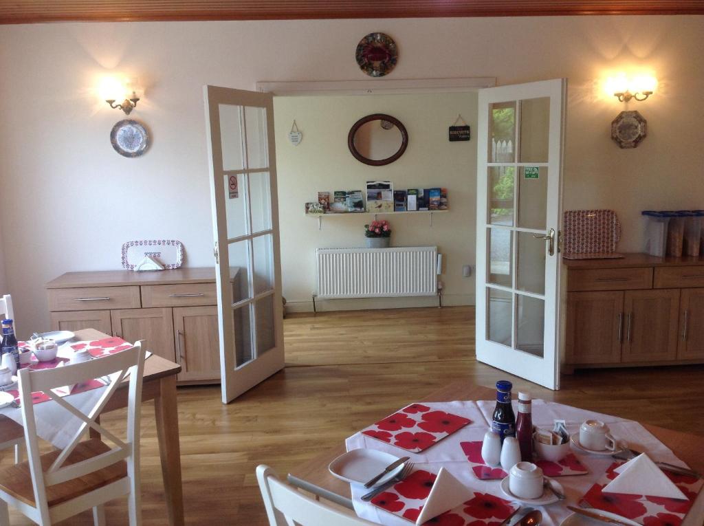 Breakfast tables prepared for guests at Auntie B's